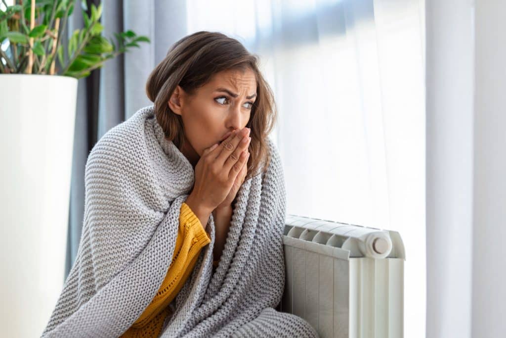 Woman freezing at home