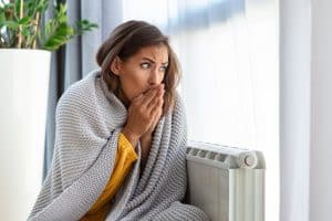 Woman freezing at home